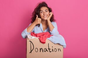 Woman packing clothes for donation