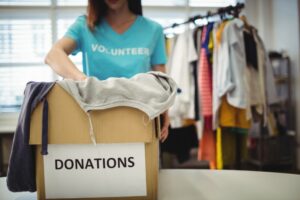 Woman packing clothes for donation